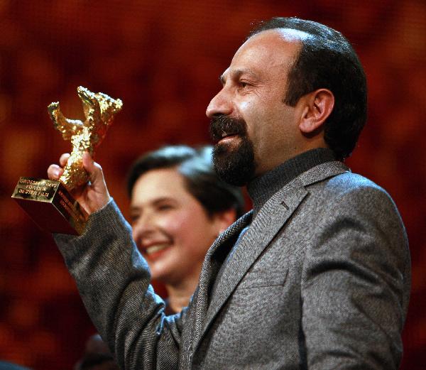 Iranian director Asghar Farhadi of the film 'Jodaeiye Nadar Az Simin' ('Nadar and Simin, A Separation') poses with the Golden Bear award for Best Film during the awards ceremony at the 61st Berlinale International Film Festival in Berlin, Feb. 19, 2011. [Xinhua]