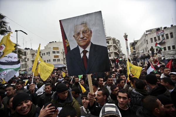 Palestinian Fatah supporters take part in a rally to support Palestinian President Mahmoud Abbas and to protest the U.S. veto, in the West Bank city of Ramallah, on Feb. 20, 2011. About 2000 Palestinians demonstrated Sunday against the U.S veto in the United Nations Security Council against a draft resolution condemning Jewish settlement in the occupied Palestinian territories. [Fadi Arouri/Xinhua]