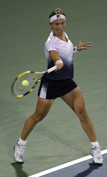 Svetlana Kuznetsova of Russia hits a return to Caroline Wozniacki of Denmark during their final match at the WTA Dubai Tennis Championships February 20, 2011. (Xinhua/Reuters Photo) 