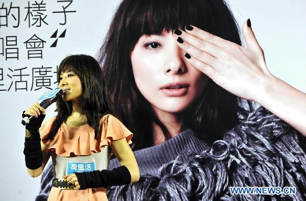 Liu Xuan performs during a promotion for her new album in Hong Kong, south China, Feb. 20, 2011. The 31-year-old former Chinese Olympic champion and now a pop singer, held a promotion campaign for her new album 'Way of Beauty' here on Sunday.