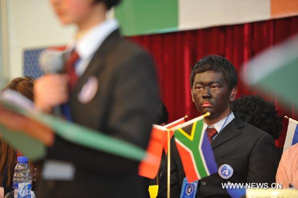 Students from China and Ireland participate in a simulative activity of Model United Nations in Guiyang, capital of southwest China's Guizhou Province, Feb. 20, 2011. A Guizhou-Ireland Youth Culture Week was held from Feb. 16 to Feb. 23, during which twenty-two Irish youngsters experienced the ordinary Chinese daily life and culture, as well as attended exchange activities with Chinese students. 