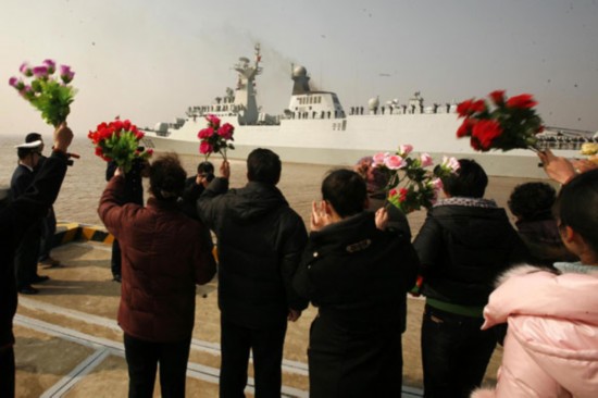 Family members wave goodbye to the sailors and Chinese naval officers who have been sent out to the Gulf of Aden for the anti-piracy mission in Zhoushan, East China's Zhejiang province, Feb 21, 2011. Missile destroyers 'Wenzhou' and 'Ma'anshan', backbone warships of the eighth Chinese naval fleet, heading for the Gulf of Aden, will meet with the supply ship of 'Qiandaohu' to conduct anti-piracy mission. [Xinhua]