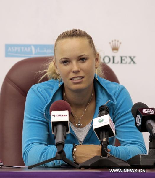 Danish tennis player Caroline Wozniacki reacts during a news conference in Doha on Feb. 21, 2011, ahead of the WTA Qatar Ladies Open that takes place from February 21-26. (Xinhua/Chen Shaojin) 