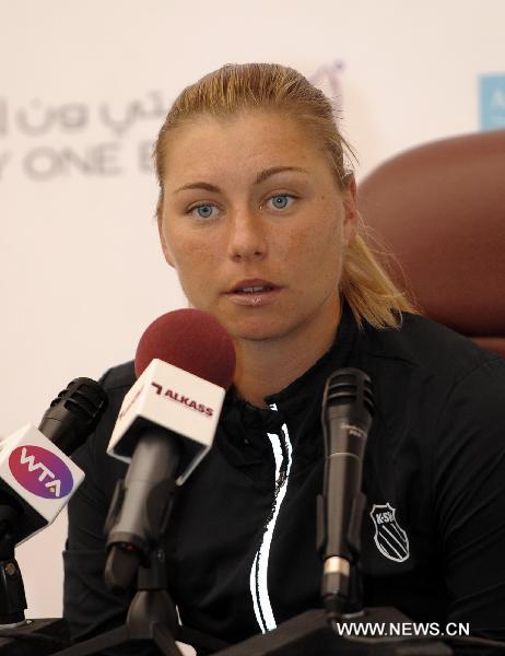 Russian tennis player Vera Zvonareva reacts during a news conference in Doha on Feb. 21, 2011, ahead of the WTA Qatar Ladies Open that takes place from February 21-26. (Xinhua/Chen Shaojin) 