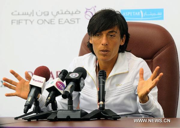 Italian tennis player Francesca Schiavone reacts during a news conference in Doha on Feb. 21, 2011, ahead of the WTA Qatar Ladies Open that takes place from February 21-26. (Xinhua/Chen Shaojin) 