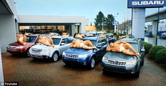 The sumo wrestlers lie across the bonnets of the Subaru Forrester model in the company's latest advert.
