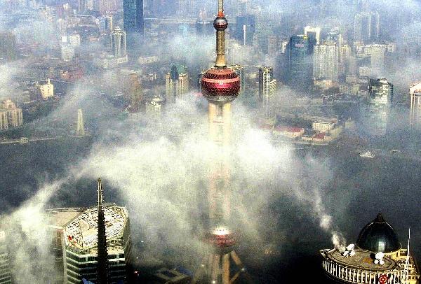 Photo taken on Feb. 22, 2011 show the view of advection fog in downtown Shanghai, east China. 