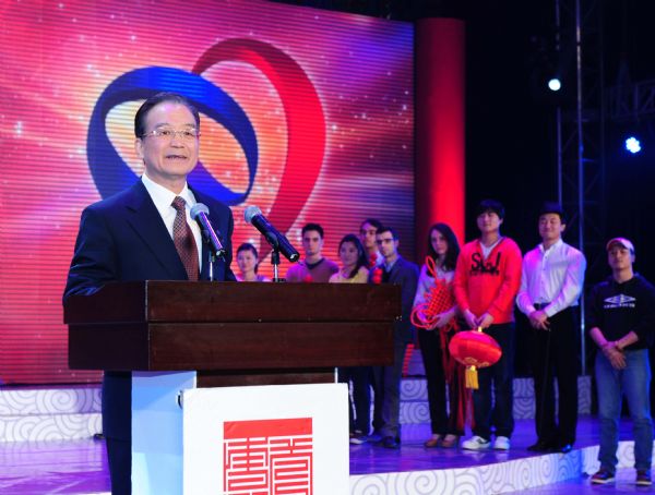 Chinese Premier Wen Jiabao (L) addresses the opening ceremony of the EU-China Year of Youth in Beijing, capital of China, Feb. 23, 2011. [Zhang Duo/Xinhua]