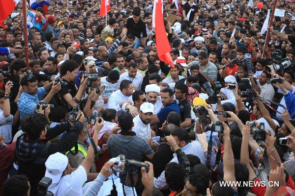 Newly released prisoners join the anti-government protest at the Pearl Square in Manama, Bahrain, Feb. 23, 2011. The Bahraini government on Wednesday announced the release of 308 prisoners following the orders by the leadership. Among those released are 23 terrorist suspects, who were charged to be a part of a cell aimed to jeopardize state security. The Information Affairs Authority said the decision to release the men was made by King Hamad bin Isa Al Khalifa.[Xinhua]