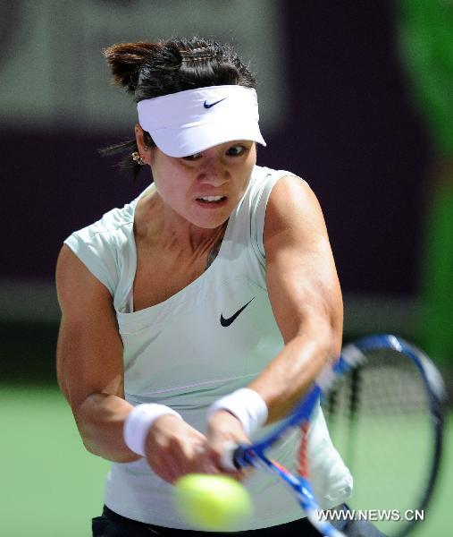 Li Na of China returns the ball during the second round match of women's singles against Fklara Zakopalova of the Czech Republic at the Qatar Ladies Open tennis tournament in Doha, Qatar, Feb. 23, 2011. Li lost 0-2. (Xinhua/Chen Shaojin) 