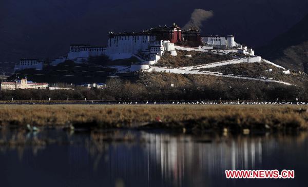 The Potala Palace is reflected in the Lhalu wetland in Lhasa, capital of southwest China&apos;s Tibet Autonomous Region, Feb. 28, 2011. 