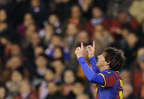 Barcelona's Argentinian forward Lionel Messi celebrates scoring during the Spanish league football match opposing Valencia and Barcelona at Mestalla stadium in Valencia.  (Xinhua/AFP Photo) 