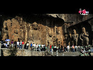 The Longmen Grottoes, located near Luoyang, Henan Province, are a treasure house of ancient Buddhist cave art. The grottos were hewed and carved during the Northern Wei Dynasty (386-534), when the rulers relocated their capital at Luoyang near the end of the 5th century. The construction of the Longmen Grottoes began in 493 during the reign of Emperor Xiaowen and continued through the successive six dynasties, including Tang and Song, for a span of over 400 years.  [Courtesy of Longmen Grottoes Scenic Spot]