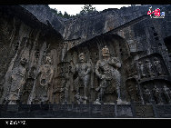 The Longmen Grottoes, located near Luoyang, Henan Province, are a treasure house of ancient Buddhist cave art. The grottos were hewed and carved during the Northern Wei Dynasty (386-534), when the rulers relocated their capital at Luoyang near the end of the 5th century. The construction of the Longmen Grottoes began in 493 during the reign of Emperor Xiaowen and continued through the successive six dynasties, including Tang and Song, for a span of over 400 years.  [Courtesy of Longmen Grottoes Scenic Spot]