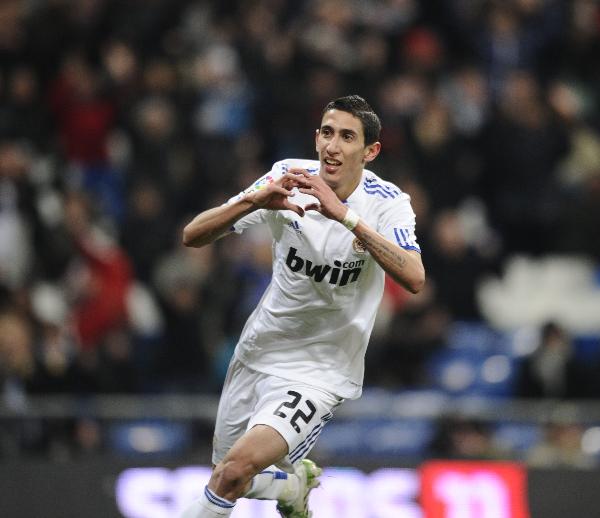 Real Madrid's Di Maria celebrates after scoring against Malaga during their Spanish first division soccer match at Santiago Bernabeu stadium in Madrid March 3, 2011. Real Madrid won 7-0. (Xinhua/AFP Photo) 