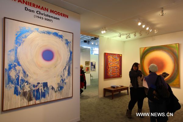 Oil paintings by Dan Christensen are displayed during the Armory Show in New York, the United States, March 3, 2011. The annual Armory Show, a leading fine art fair, kicked off on Thursday with the participation of artists, galleries, collectors, critics and curators from all over the world. (Xinhua/Wu Kaixiang) (zw) 