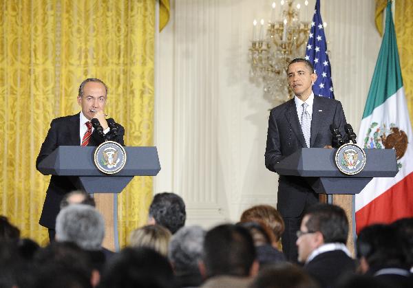 U.S. President Barack Obama (R) and Mexican President Felipe Calderon hold a joint news conference after their meeting at the White House in Washington D.C., capital of the United States, March 3, 2010. Obama on Thursday reaffirmed his support for Mexico's efforts to combat drug smuggling as bilateral relations are strained over a number of issues. [Zhang Jun/Xinhua]