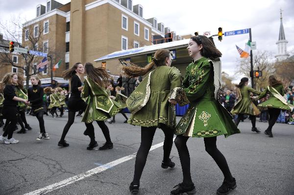 Young people dance during the 30th annual Alexandria St. Patrick&apos;s Day Parade in Alexandria, Virginia, the United States, March 5, 2011. [Xinhua] 