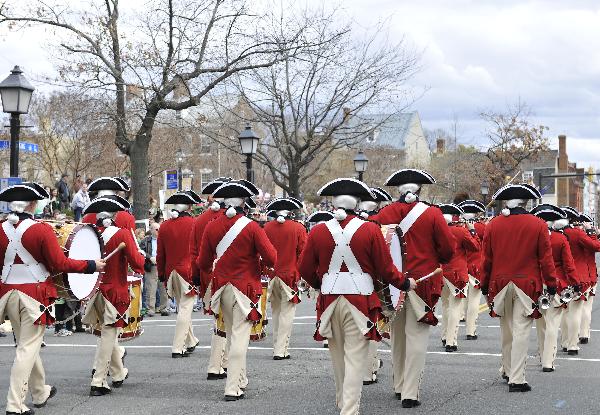 U.S. Indepedence War honor guards perform during the 30th annual Alexandria St. Patrick&apos;s Day Parade in Alexandria, Virginia, the United States, March 5, 2011.