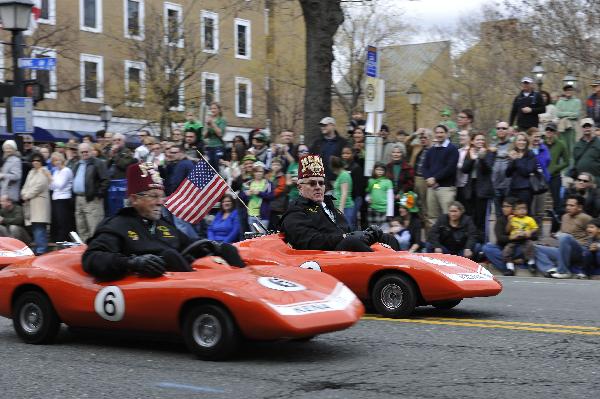 People drive miniature orange Corvettes during the 30th annual Alexandria St. Patrick&apos;s Day Parade in Alexandria, Virginia, the United States, March 5, 2011. 