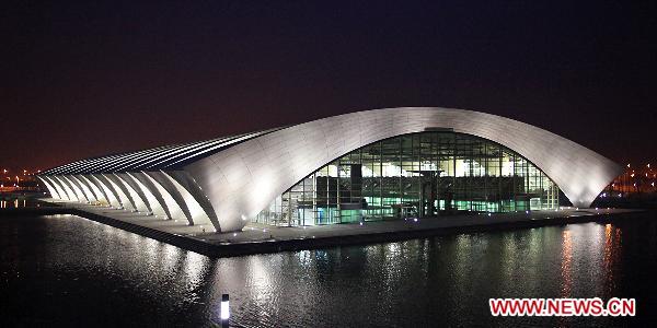 Photo taken on March 8, 2011 shows a night view of Shanghai Oriental Sport Center which is under lighting test. The 14th FINA World Championships is to be held here from July 16 to July 31, 2011. [Xinhua/Xu Zhengkui]