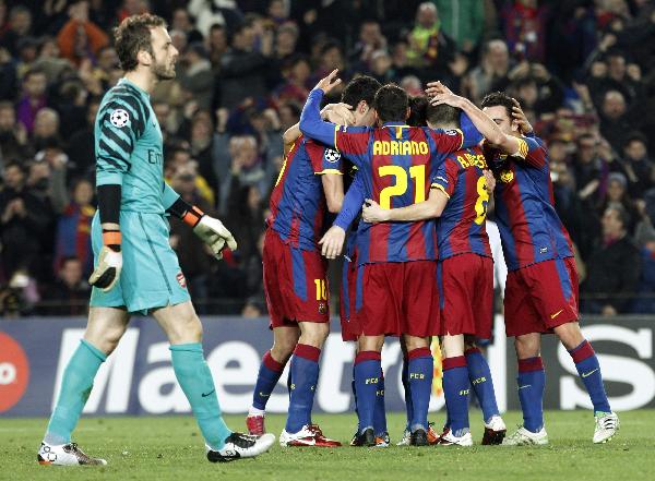 Barcelona's players celebrate after scoring a goal during their Champions League round of 16, second leg football match FC Barcelona vs Arsenal on March 8, 2011 at Camp Nou stadium in Barcelona. Barcelona beat Arsenal 3-1.(Xinhua/Reuters Photo)