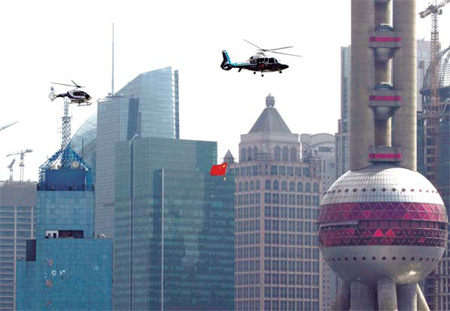 Two police helicopters fly past the Oriental Pearl Tower in Shanghai on Oct 2, 2009. The city's medical authority has reached an agreement with the local police bureau to dispatch police helicopters for first aid.