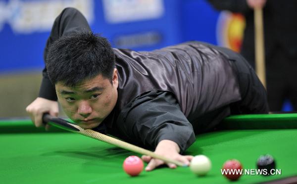 Ding Junhui of China competes during the group round against Graeme Dott of Scotland at the Hainan Snooker Classic in Boao, south China's Hainan Province, March 10, 2011. Dott won the match by 2-0.(Xinhua/Guo Cheng) 