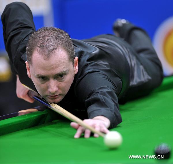 Graeme Dott of Scotland competes during the group round against Ding Junhui of China at the Hainan Snooker Classic in Boao, south China's Hainan Province, March 10, 2011. Dott won the match by 2-0.(Xinhua/Guo Cheng) 