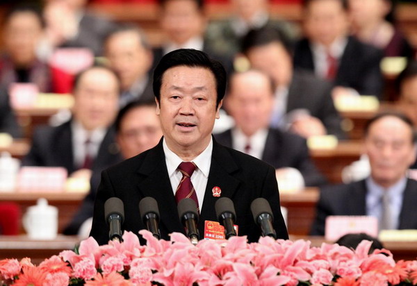 Chief Justice Wang Shengjun, president of the Supreme People's Court, delivers a report on the court’s work at the Fourth Session of the 11th National People's Congress at the Great Hall of the People in Beijing on Friday. [Photo/Xinhua]
