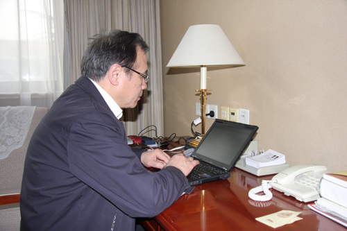 NPC deputy Chu Junhao checks e-mails shortly after a morning's washing at Jingxi hotel in Beijing on Friday, March 11, 2011. As a member of Chinese Academy of Sciences (CAS), Chu deals with his work at Shanghai Institute of Technical Physics of the CAS by e-mail and phone every day during the NPC's annual session.