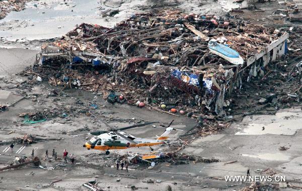A Japanese Self Defense Force helicopter rescues people in Minamisanriku, Miyagi Prefecture, northeastern Japan, March 12, 2011. Over 1,000 people has been killed after Friday's great earthquake and ensuing huge tsunami hit northeast Japan, public broadcaster NHK reported Saturday. [Xinhua]