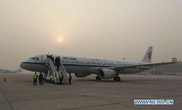 The plane, which the China's International Rescue Team will take, parks at Beijing Capital International Airport in Beijing, capital of China, March 13, 2011. The China's International Rescue Team including 15 members left for the quake-hit region in Japan Sunday morning. [Xinhua]