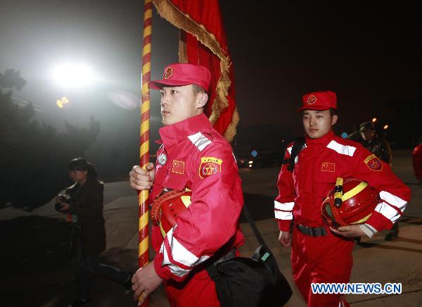 Members of the China's International Rescue Team gather at Beijing Capital International Airport in Beijing, capital of China, March 13, 2011. [Xinhua]