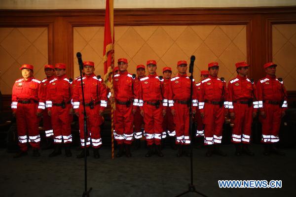 Members of the China's International Rescue Team gather at Beijing Capital International Airport in Beijing, capital of China, March 13, 2011. [Xinhua]