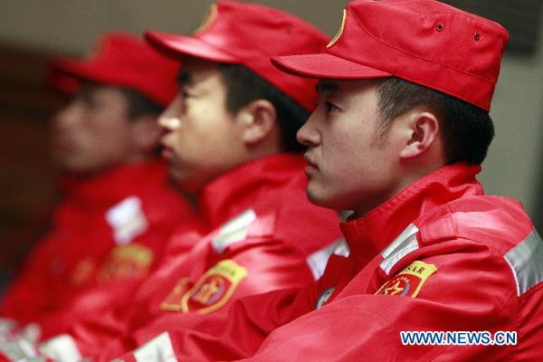 Members of the China's International Rescue Team gather at Beijing Capital International Airport in Beijing, capital of China, March 13, 2011. [Xinhua]