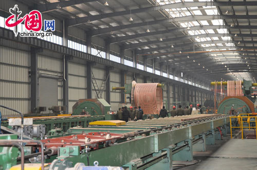 Copper tubes are processed at a Zhejiang Hailiang Co. Ltd. factory in Tongling, Anhui Province. The company, based in Zhejiang Province, is attempting to explore and expand into the booming market of Anhui. [Wang Wei/China.org.cn]
