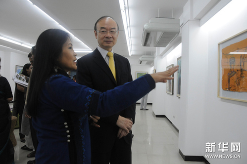 Zhang Xianyi (right), Chinese Ambassador to Bangladesh, visits an art, film and photography exhibition titled ' Colorful Yunnan' which opens in Bangladesh's capital Dhaka on March 11.