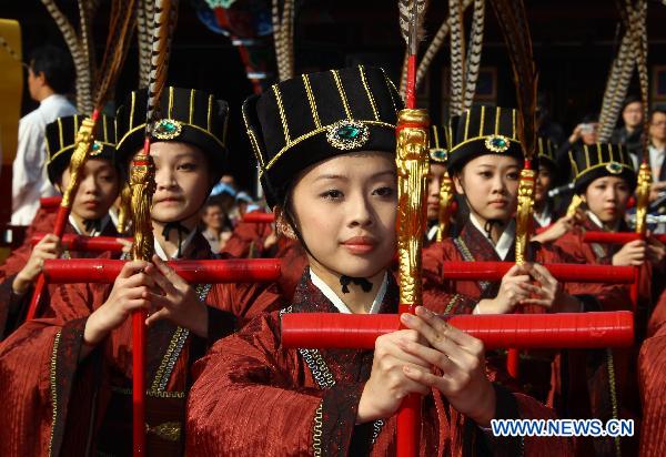 Attendees are seen performing in a ceremony worshipping Confucius in Taipei, southeast China's Taiwan, March 13, 2011. Confucius (551 B.C. -- 479 B.C.), native of Qufu in east China's Shandong Province, was a great thinker, philosopher, and educator in ancient China.