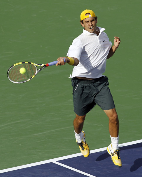 Ryan Sweeting of the U.S. returns a shot against Rafael Nadal of Spain during their match at the Indian Wells ATP tennis tournament in Indian Wells, California March 14, 2011. (Xinhua/Reuters Photo) 