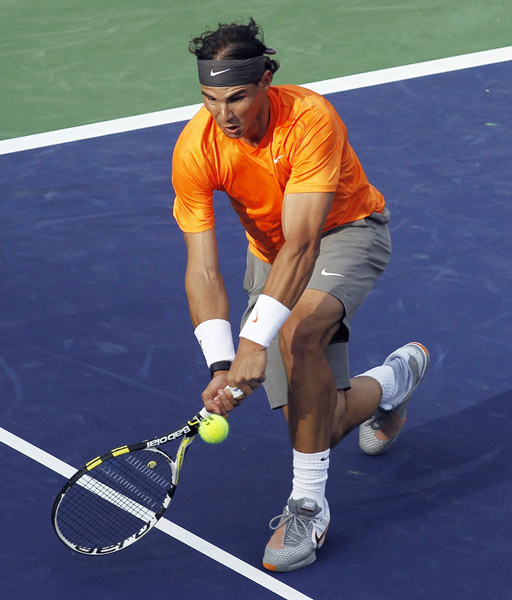 Rafael Nadal of Spain returns a shot against Ryan Sweeting of the U.S. during their match at the Indian Wells ATP tennis tournament in Indian Wells, California, March 14, 2011. (Xinhua/Reuters Photo) 