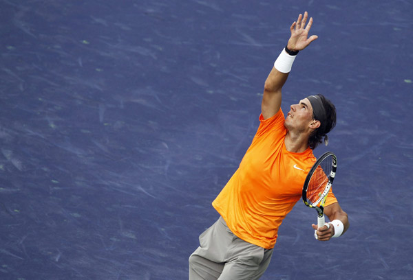 Rafael Nadal of Spain serves against Ryan Sweeting of the U.S. during their match at the Indian Wells ATP tennis tournament in Indian Wells, California, March 14, 2011. (Xinhua/Reuters Photo) 