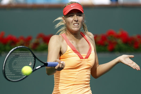 Maria Sharapova of Russia returns a shot against Aravane Rezai of France during their match at the Indian Wells WTA tennis tournament in Indian Wells, California, March 14, 2011.(Xinhua/Reuters Photo