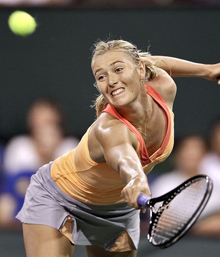 Maria Sharapova of Russia returns a shot to compatriot Dinara Safina during their BNP Paribas Open match in Indian Wells on Tuesday