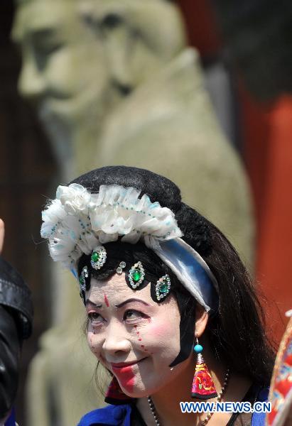 An actress of a local troupe practises before the Mulian Opera performance in Xinchang County, east China's Zhejiang Province, March 14, 2011.