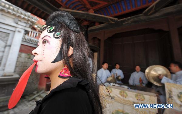 An actress performs the Mulian Opera in Xinchang County, east China's Zhejiang Province, March 14, 2011.
