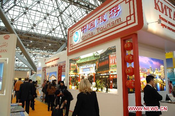 People visit the pavilions of Chinese Tourism during the 18th international tourism exhibition in Moscow, Russia, March 16, 2011. The four-day tourism exhibition kicked off in Moscow on Wednesday.
