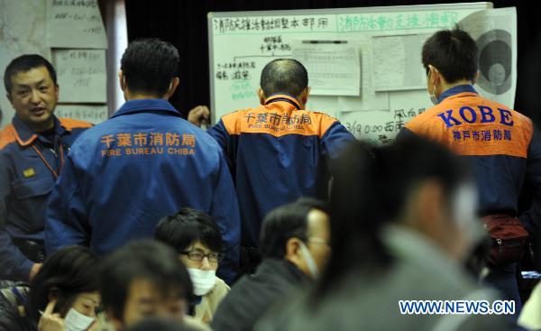 Firefighters discuss at the disaster countermeasures unit in Fukushima, March 19, 2011. Nuclear experts, emergency staff and firefighters gathered here to deal with the situation of Japan&apos;s Fukushima No.1 nuclear power plant.