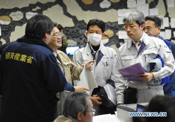 Experts work at the disaster countermeasures unit in Fukushima, March 19, 2011. Nuclear experts, emergency staff and firefighters gathered here to deal with the situation of Japan&apos;s Fukushima No.1 nuclear power plant.