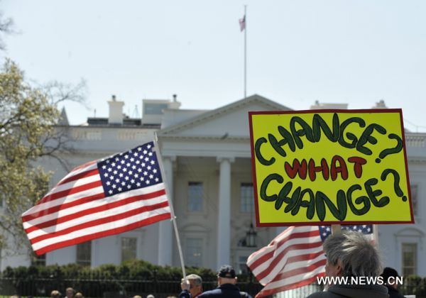 Protestors hold placards during an anti-war rally to commemorate the 8th anniversary of the Iraq War outside the White House in Washington D.C., capital of the United States, March 19, 2011. (Xinhua/Zhang Jun) (zw) 